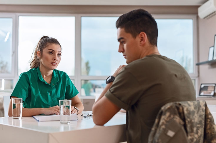 woman talking with soldier