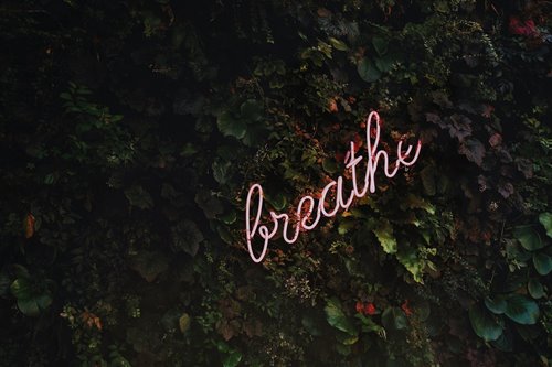 the word breathe on a nature background