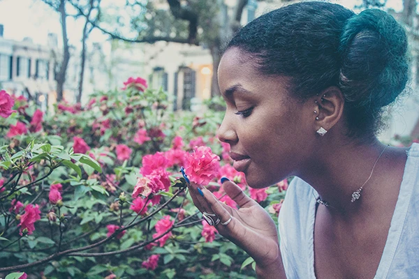 woman smelling roses