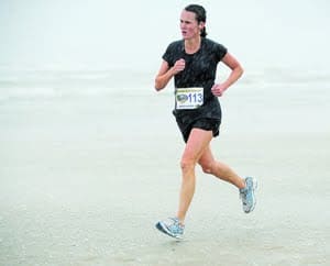 woman running on the beach