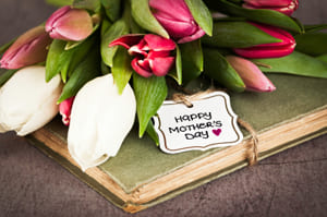 pink and white tulips with a happy mother's day card