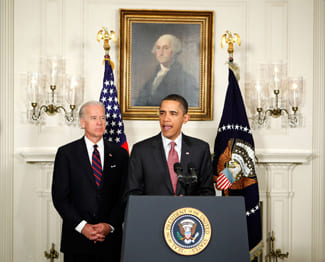 President Obama speaking and Vice President Joe Biden