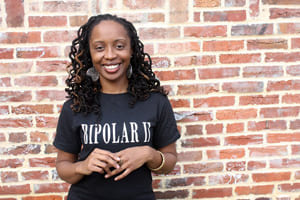 woman wearing a black tee shirt with words Bipolar II