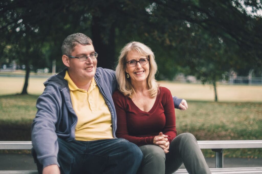 mom and son sitting on a bench