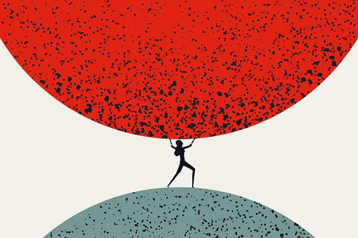 Woman holding up large sphere