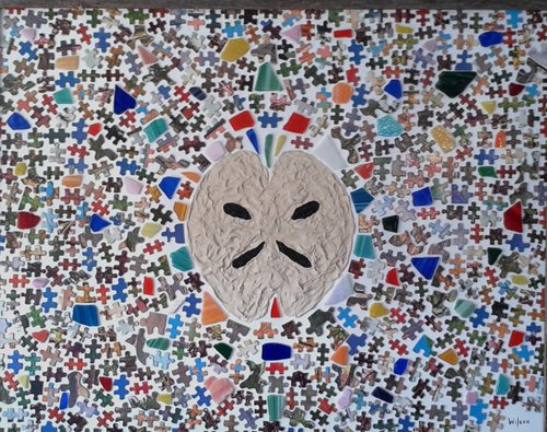 brain in the middle of a mosaic of puzzle pieces