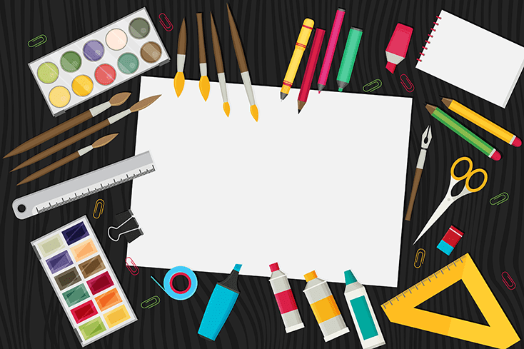 Art supplies around a blank piece of paper