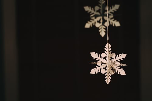 decorative paper snowflakes on a dark background