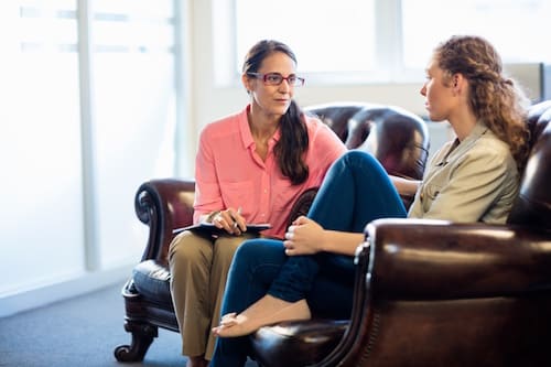woman talking with a therapist