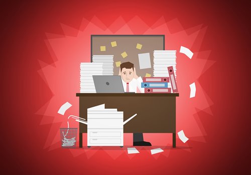 illustration of a man overwhelmed with paperwork at his desk