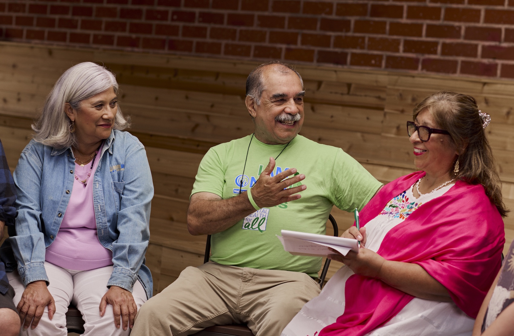 Group of NAMI Walks team members sitting in a circle for a team meeting
