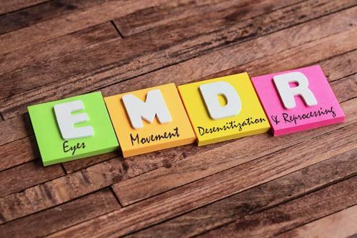 colored blocks with letters and words: E (eyes) M (movement) D (desensitization) R (reprocessing)