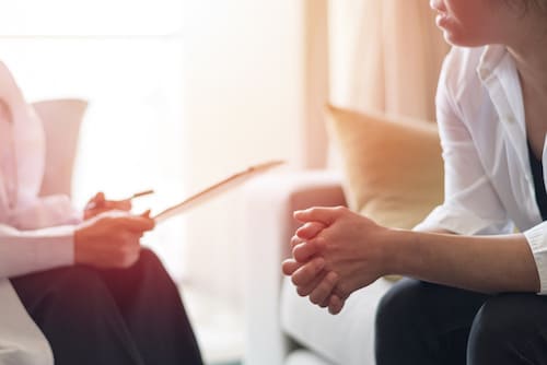a patient speaking with a therapist