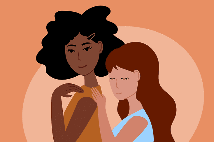 woman comforting another woman